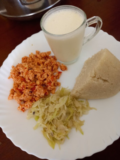 A picture of Ugali cabbage and fried eggs.