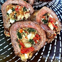 A picture of Wagyu Flank Steak Stuffed With Spinach, Artichokes, and Feta.