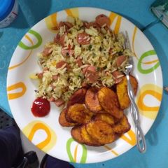 A picture of Fried Rice🍚 and plantain 🍌.