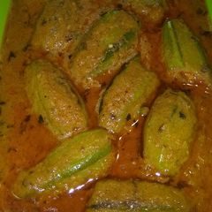 A picture of Stuffed Pointed Gourd in thick tomato gravy.