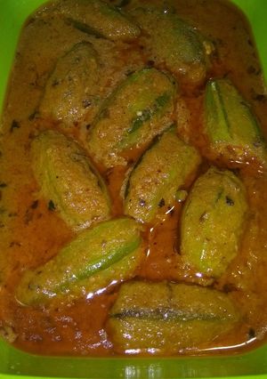 A picture of Stuffed Pointed Gourd in thick tomato gravy.