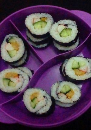 A picture of Sushi Periment with chicken Nugget and Crabstick.