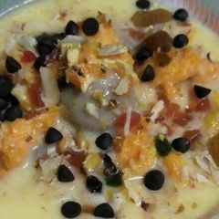 A picture of # Tiffin box # custard with ball.