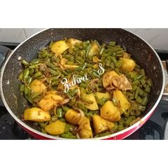 A picture of French beans and aloo dry sabzi without ginger garlic.