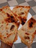 فطيرة محشية بشكشوكة البصل و الطماطم 👍😋