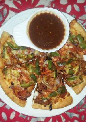 A picture of Chicken tikka pizza 🍕#ramadan challenge 6 To 12 may.