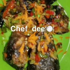 A picture of Fried fish with vegetables.