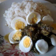 Ofada rice,Vegetable stew,beef and Boiled Eggs A picture of Ofada rice,Vegetable stew,beef and Boiled Eggs.