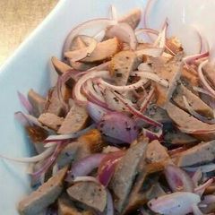 A picture of Sausage and onion salad.