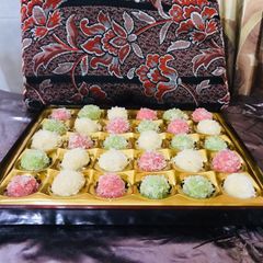A picture of Colourful coconut balls.