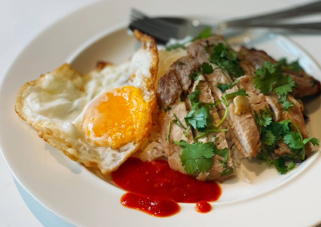 Grilled pork loin served with rice & fried egg