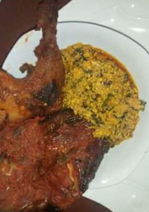 A picture of Egusi with grilled chicken and fufu.