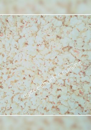 A picture of Home made popcorn with milk.