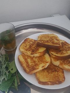 A picture of Pan-Toasted Bread with Wormwood Tea.