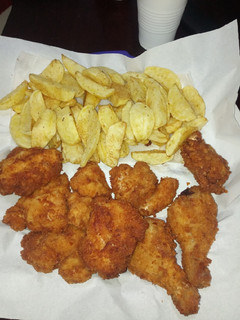 A picture of Breadcrumbed chicken with fries.