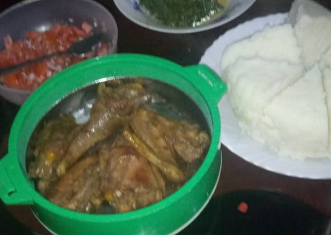 Ugali served with chicken and kales