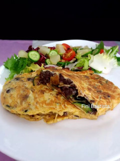 Una foto de Tortilla de calabacín y morcilla de Burgos