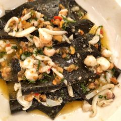 A picture of Black handkerchief pasta with cuttlefish, mussels, prawn and chilli.