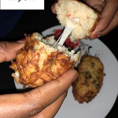 A picture of Cheesy potatoes and rice balls.