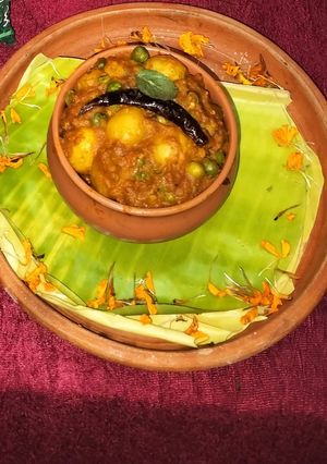 A picture of Spiced baby potato curry with tomato.