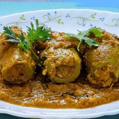 A picture of Niramish Potol er Dolma/ Stuffed pointed Gourds with Cottage Cheese (bengali veg sabzi).