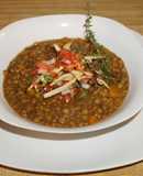 Vegan lentil soup with crispy tortilla strips