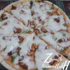 A picture of Thin Crust Chicken Tikka Pizzas.