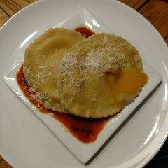 A picture of Raviolo Al Uovo.