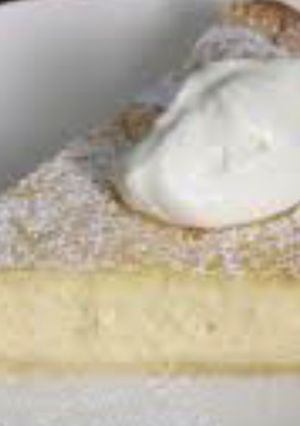 Una foto de New York cheesecake (tarta de quesito bien rica)