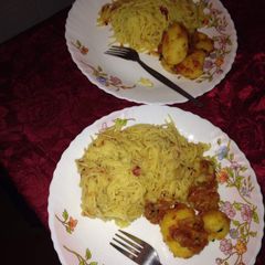 A picture of Spaghetti with fried potatoes.