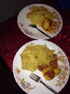 A picture of Spaghetti with fried potatoes.