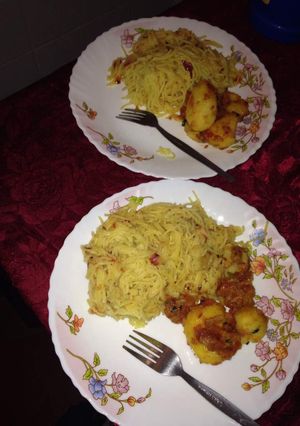 A picture of Spaghetti with fried potatoes.