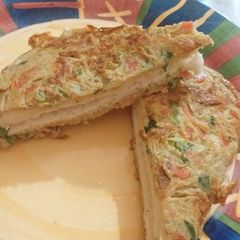 A picture of Egg veg bread sandwich.