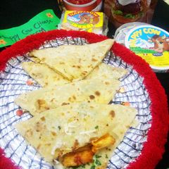 A picture of Chicken tikka cheese paratha.