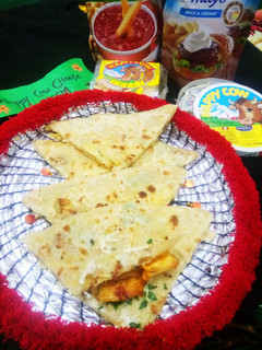 A picture of Chicken tikka cheese paratha.