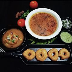 A picture of Tamilnadu Snack Medu vada with Rasam.