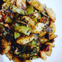 A picture of Broad beans and potato stir fry.