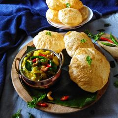 A picture of Potato masala with poori.