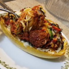 A picture of Spaghetti & Meatball filled Spaghetti Squash Boats.