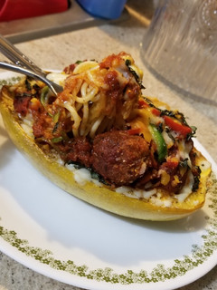 A picture of Spaghetti & Meatball filled Spaghetti Squash Boats.