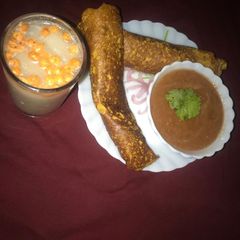 Onion cheela with tomato chutney and Masala Chaas A picture of Onion cheela with tomato chutney and Masala Chaas.