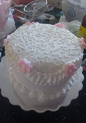 Una foto de Torta de fondant relleno de mousse de coco