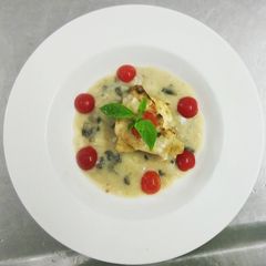A picture of Baked chicken with mushroom sauce.