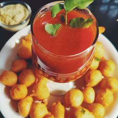 A picture of Bonda with tomato soup.