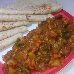 A picture of Paratha and saucr.