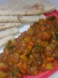 A picture of Paratha and saucr.