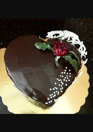 A picture of Chocolate Mirror Glaze Cake without Egg, Maida & heart cake Mold.