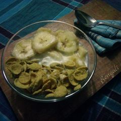 A picture of Milk and Honey Healthy Corn flakes Recipe with Banana.