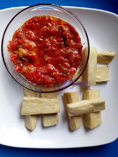 A picture of Tomatoes sauce paired with fried yam.