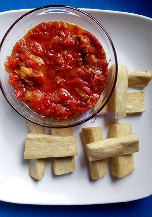 A picture of Tomatoes sauce paired with fried yam.